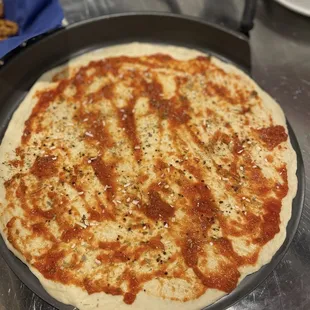 The dough we made plus sauce &amp; seasonings: black garlic salt, Italian blend, and onion granules.