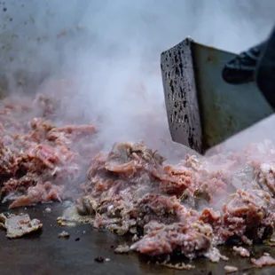 meat being cooked in a pan