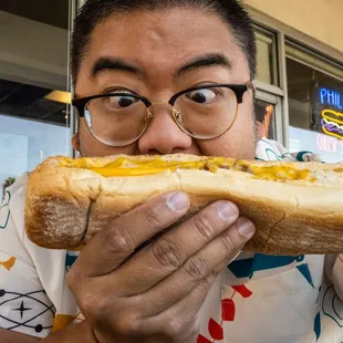 a man eating a hot dog