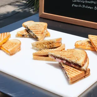 a cut in half sandwich on a cutting board