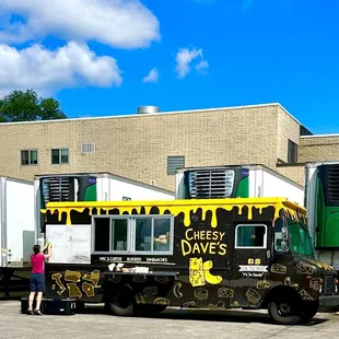 a woman standing in front of a truck