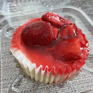 a strawberry cupcake in a plastic container