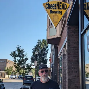 a man standing in front of a building