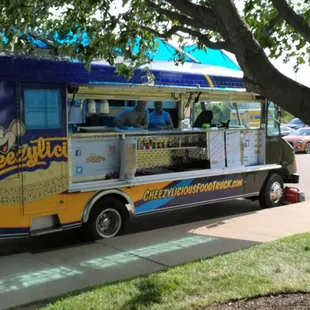 a blue and yellow food truck
