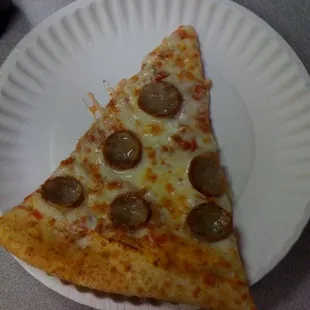 A sausage slice, NY style!  Thin crust, folded over, hot... This is everything that pizza should be!