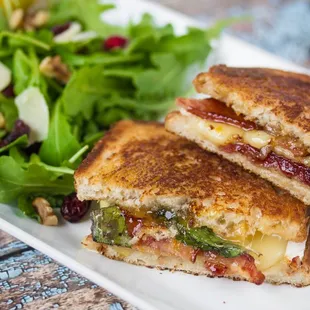 a grilled cheese sandwich and a salad