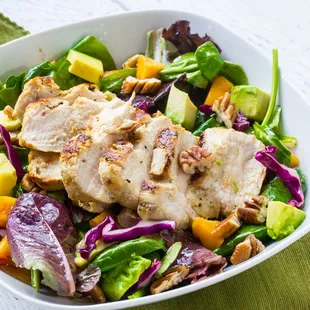 a salad with chicken and vegetables