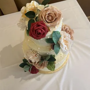 3 tiered wedding cake with faux flowers