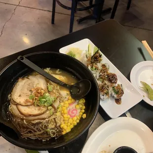 a bowl of ramen and a plate of sushi
