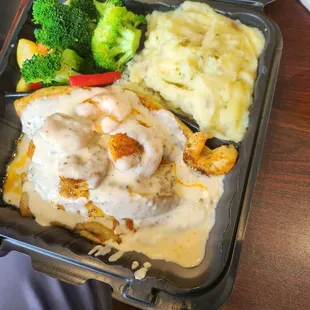 Crab and shrimp stuffed tilapia, mashed potatoes and veggies