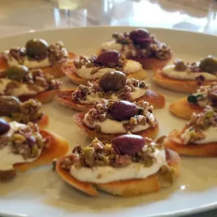 Crostini with herbed ricotta and tapenade