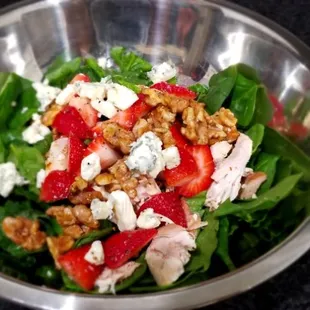 Spring mix , strawberry and feta salad with toasted walnuts