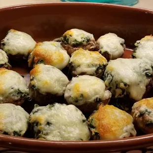 Artichoke and spinach stuffed mushrooms , yumm!!