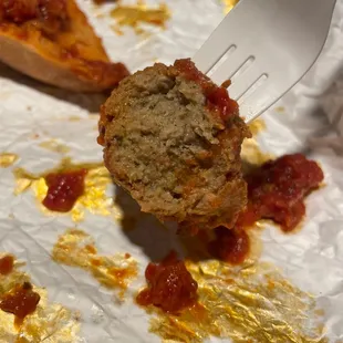 a piece of meatball on a fork