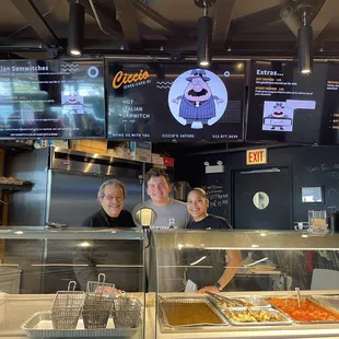 two men behind the counter