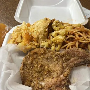 Fried pork chop dinner with baked Mac and cheese and spaghetti