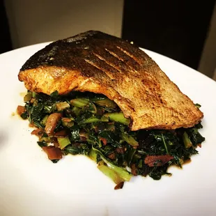 Crispy skin Salmon over Balsamic braised Collard Greens.