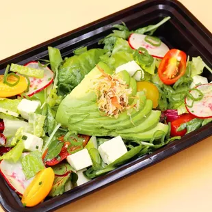 a salad in a plastic container