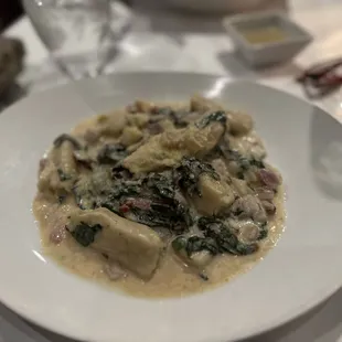 a white plate of food on a table