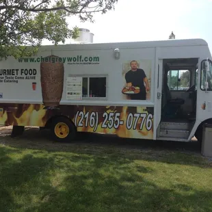 a food truck parked in a field