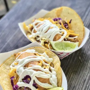 two tacos on a table