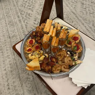Plate of appetizers set aside for bride and groom during the reception.
