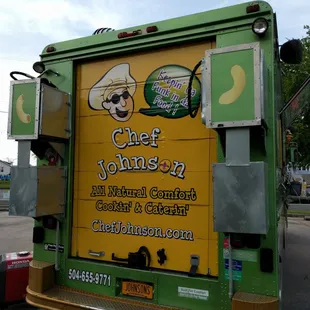 a green and yellow food truck