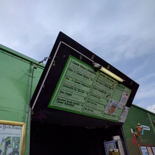 a menu on a green building