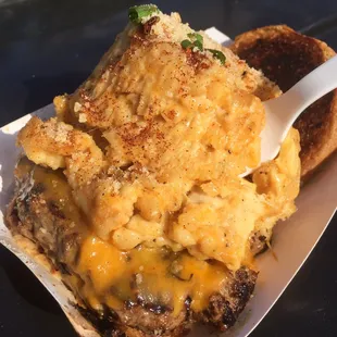 HUGE SCOOP OF MAC &amp; CHEESE ATOP A CHEESEBURGER: $10. Delicious! The burger is cooked pink with caramelized onions!