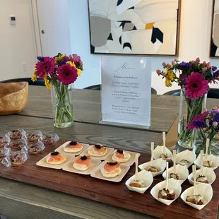 Canapé small bites, steak and truffle tartar, salmon mousse bites with caviar, roasted butternut squash and stracciatella cheese