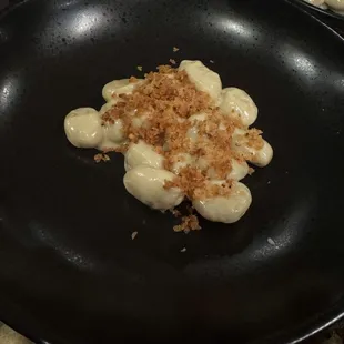 From scratch gnocchi, chefs signature Mac and cheese sauce with Gruyère, aged white cheddar, foie gras butter, toasted breadcrumbs