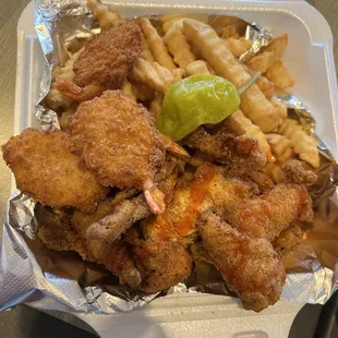 Fried catfish, fries, and shrimp