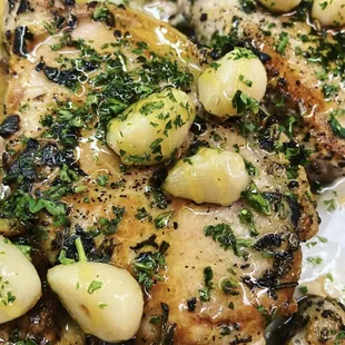 a chicken dish with potatoes and herbs
