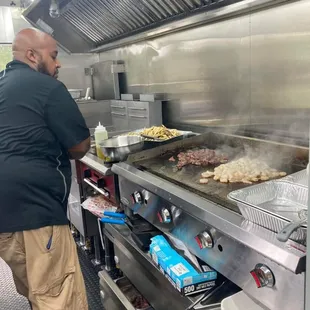 Chef Kenny preparing shrimp and steak