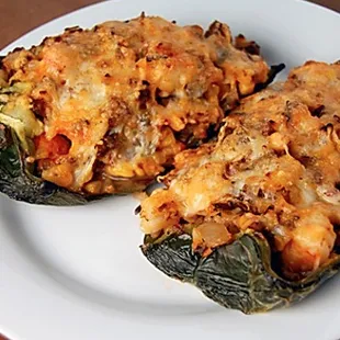 two stuffed poblao peppers