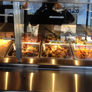 a variety of food in a buffet