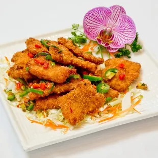 a plate of fried tofu and vegetables