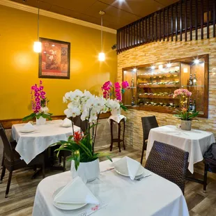 a dining room with tables and chairs