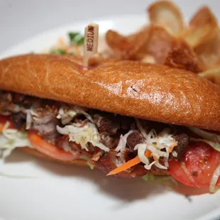 a sub sandwich and potato chips