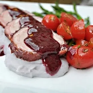 Bacon Wrapped Roasted Pork Tenderloin over Purple Mashed Potatoes with Raspberry Chipotle Glaze