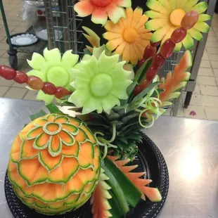 Swap the Floral Centerpiece for a Hand Carved Melon and Fruit Flower Display!