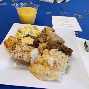 Chicken &amp; waffles, grits &amp; shrimp, potatoes, eggs, crab cake, and a mini peach cobbler.