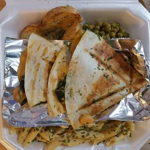Shrimp quesadilla with pasta, peas, and garlic bread.
