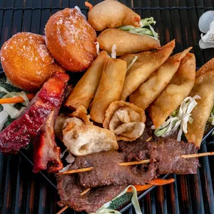 PO PO PLATTER: Beef skewers, crab puffs, spring egg rolls, ribs, fried shrimp, and more!