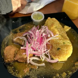 Tacu Tacu Chef Paz with seco de res (fried rice with beans combined Beef Stew With Cilantro Sauce).