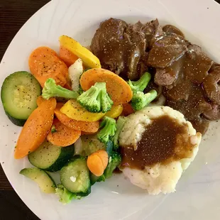 Filet medallions cooked perfectly! Mashed potatoes and gravy and tons of veggies! Soooo good!