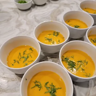 Carrot soup infused with ginger, lemongrass, and coconut milk