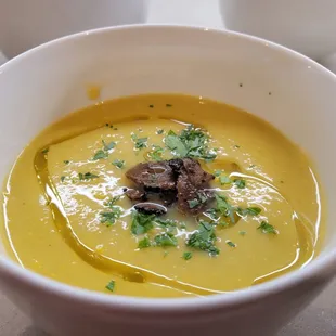 White asparagus soup with black truffles