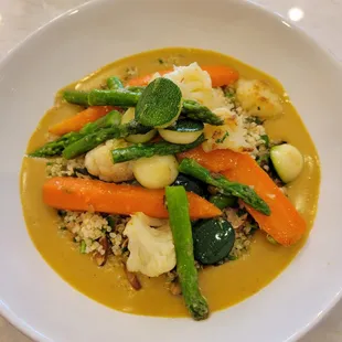 Baby garden vegetables with coucous and Thai coconut curry sauce