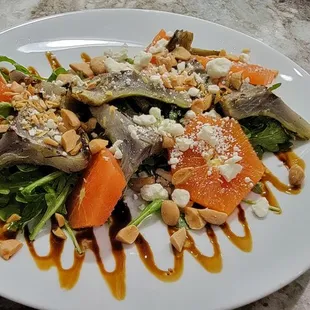 Grilled artichokes with Cara Cara oranges, arugula, goat cheese, and balsamic reduction